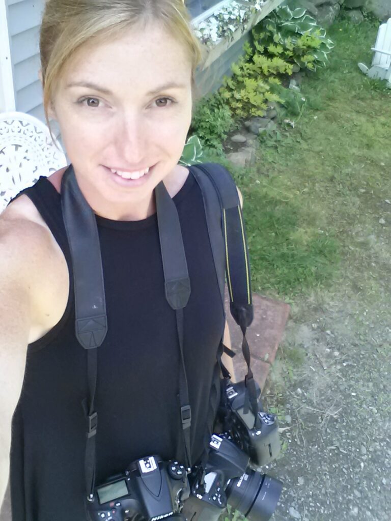 Photographer Roxanne Herres with cameras Photographer Roxanne Herres with cameras